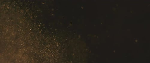 Schwebende Goldstaubpartikel