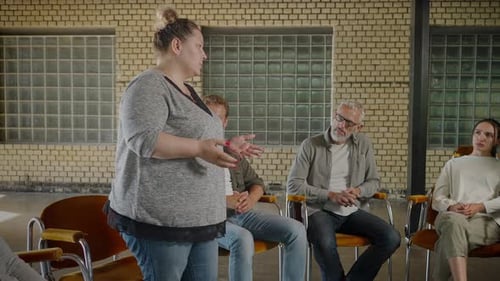Adults Sitting and Listening in Group Circle