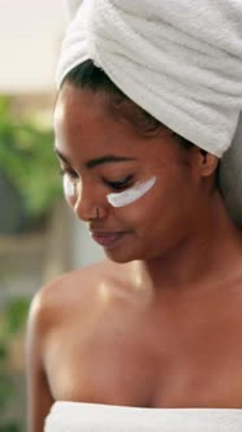 Woman Applies Moisturizer After Shower, Close Up