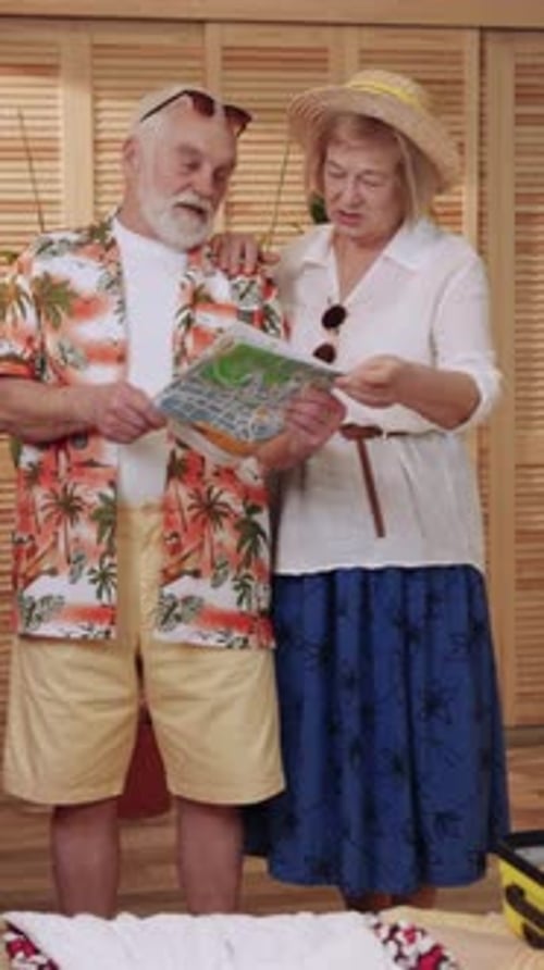 Senior Couple Planning a Trip Together Indoors