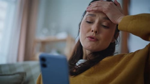 Nervous Woman Staring Mobile Phone Home Closeup Worried Lady Reading Cellphone