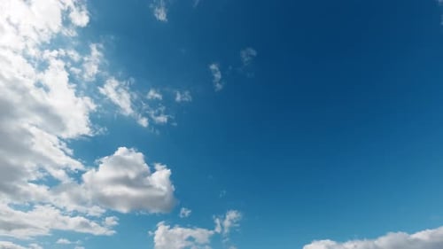 Clouds Drifting Across Blue Sky in Daytime