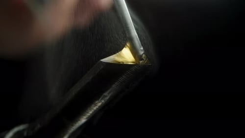 Close Up of Tool Melting Gold Material