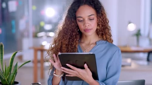 Focused business woman on tablet in office for company market research, planning