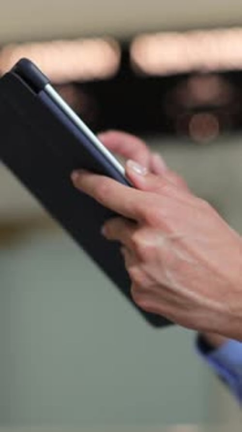 Vertical Video Close Up of Unrecognizable Hotel Worker Wearing Uniform Standing in Lobby or Lounge
