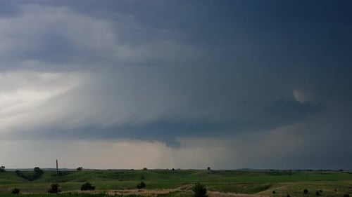Storm Clouds Rolling Over Green Fields