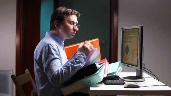 Office Worker Struggling with Excessive Paperwork at Computer Desk ...