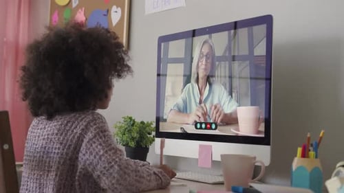 Smart Small African School Child Girl Online Learning with Online Remote Teacher
