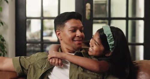 Dad, girl and face with smile on sofa, home and bonding with love, hug and connection in lounge