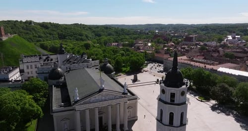 Forward Drone Shot Above Vilnius Cathedral, Bell Tower, Main Square. Lithuanian Capital City