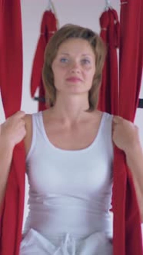 Woman Doing Aerial Yoga Indoors