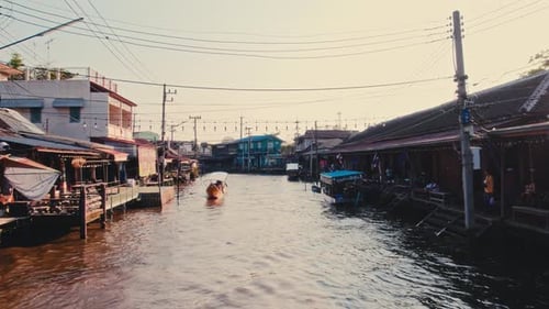 Boats Navigate Floating Market in Thailand