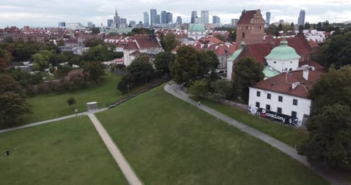 Vertical aerial view of the old town of Vilnius, Lithuania, and the tall modern buildings in front,