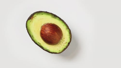 Avocado Half with Pit on White Background