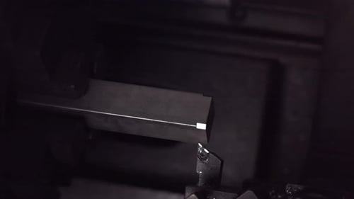 Automated Lathe Cutting Metal Stock for Industrial Project