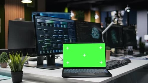 Green Screen Mockup Laptop in Office Used to Automate App Development
