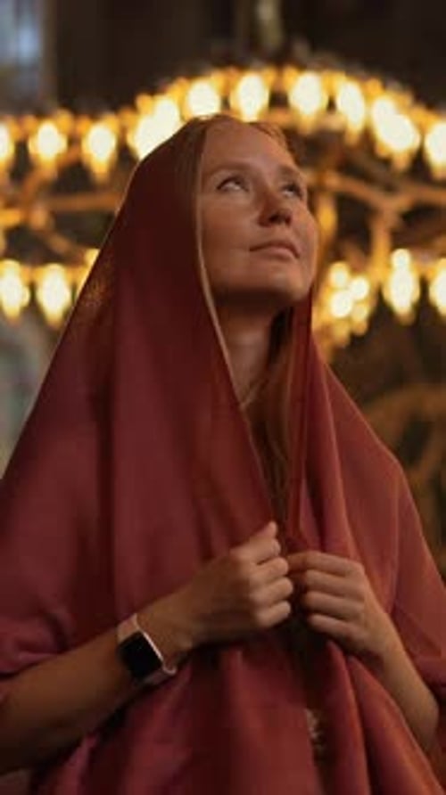 In the Heart of Istanbul a Scarfclad Woman Tourist Stands Before Ayasofya's Timeless Grandeur Her