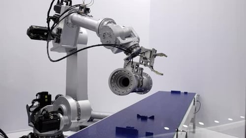 Industrial Robot Arm Manipulating Component on Conveyor