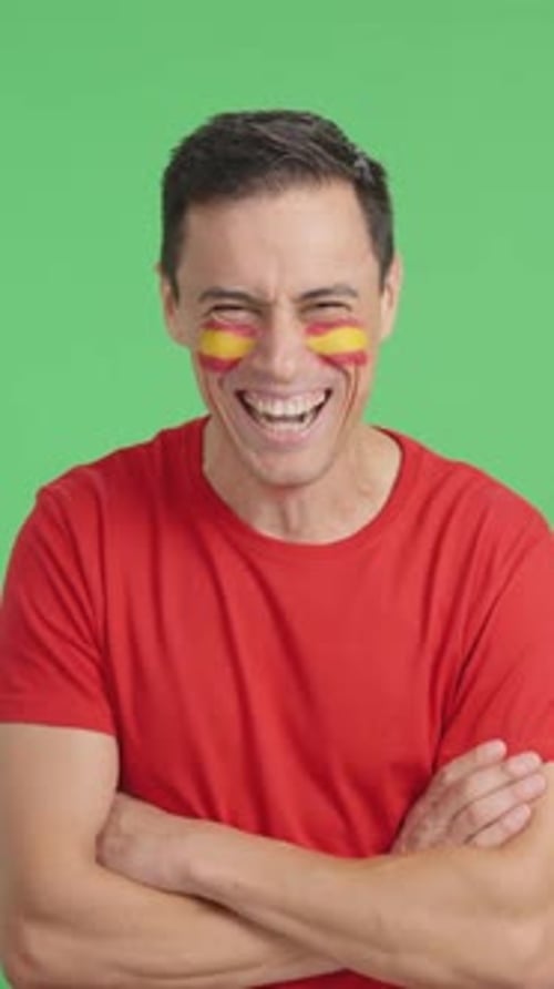 Man Smiling with Arms Crossed on Green Screen