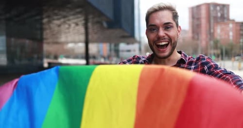 Gay Man with Makeup on Having Fun Holding Lgbt Rainbow Flag Outdoor Bisexuality