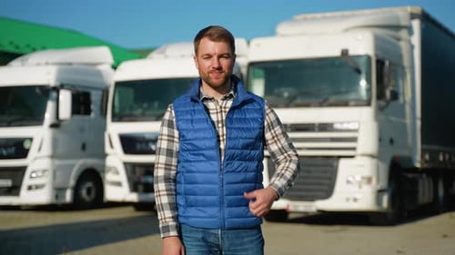 Truck Driver Smiling in Parking Lot