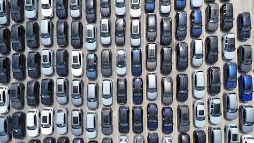 Aerial View of a Variety of Parked Cars Displaying Various Colors and Different Models