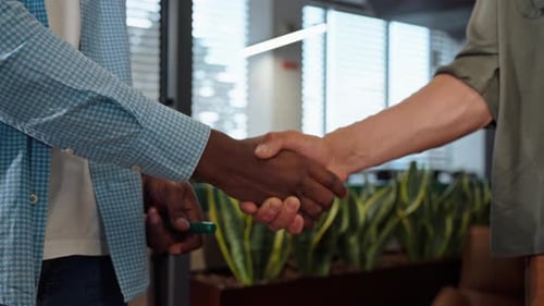 B Closeup View of Buisness Partners Shaking Hands Coworking and Collaboration Teamwork Concept