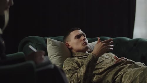 Young Adult Military Man in Therapy Session