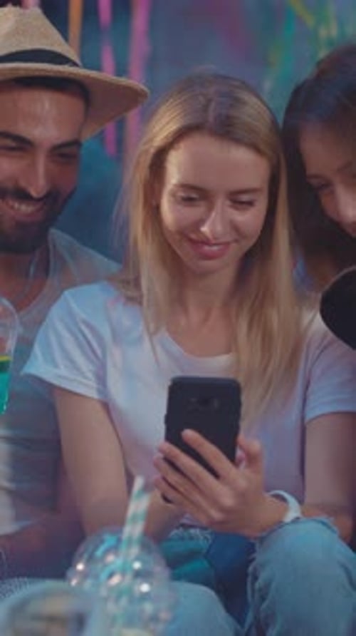 Friends Watching Phone Together