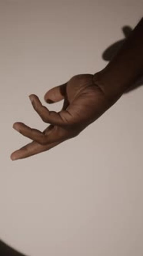Close-up of Arm of Unknown African American Man Rotating Gradually