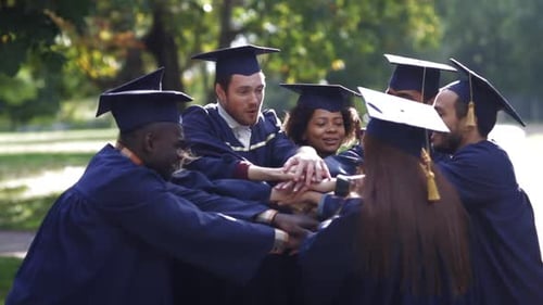 Group of Graduates Celebrates in Caps and Gowns