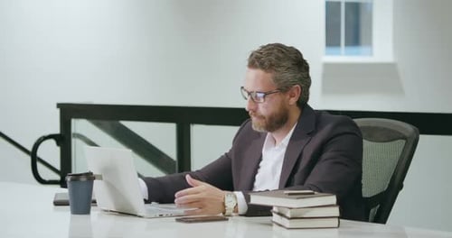 Modern Office Successful Caucasian Business Man in Business Suit Using Laptop Working Remotely