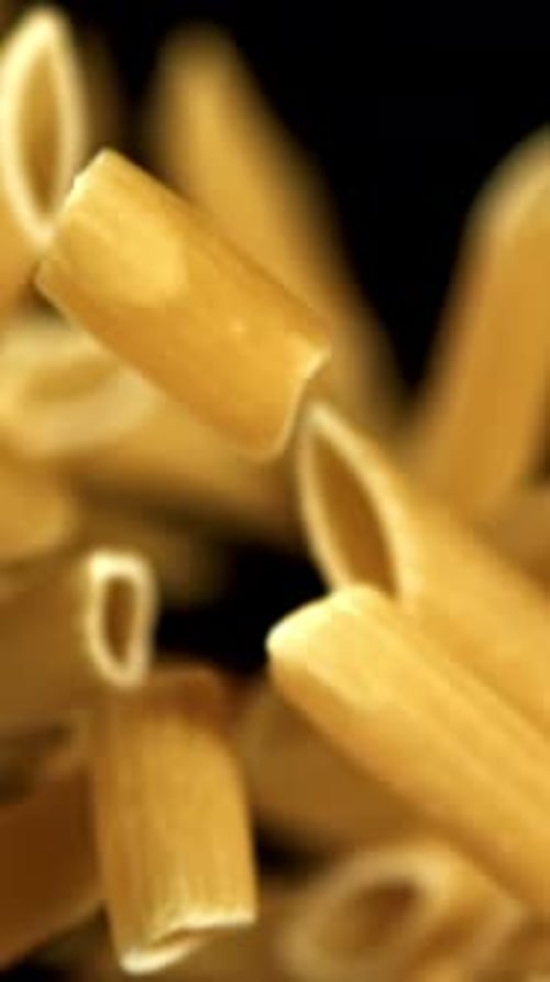 Super Slow Motion Flying Dry Penne Pasta Filmed on a Highspeed Camera at 1000 Fps