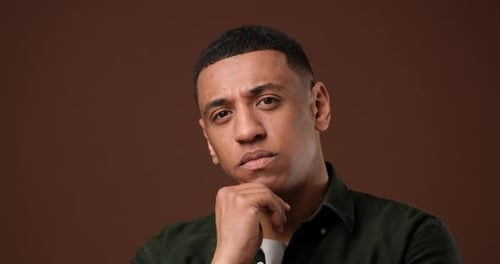 Young Adult Man Thinking Intensely Close Up