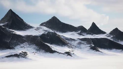 Rocky Mountain Peaks During Cloudy Blue Sky Sky