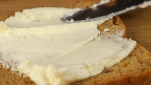 Butter Spreads on Bread Slice for Breakfast