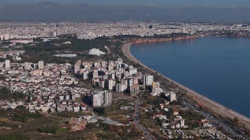 Aerial View of Antalya Coastline with Sandy Beaches and Urban Skyline