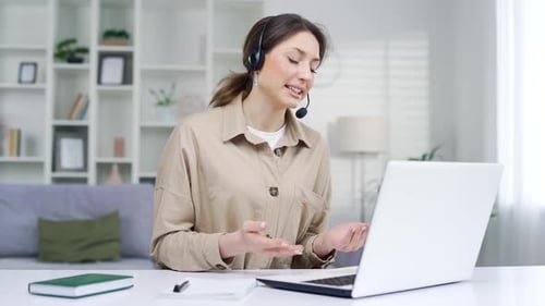 Young Caucasian woman working remotely sitting in home office. Business Female freelancer