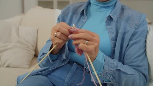 Knitting Pink Yarn Indoors, Close Up