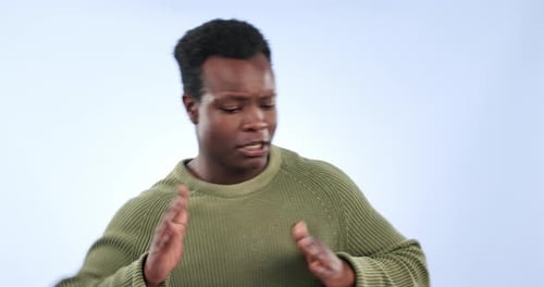 Celebration, excited and black man dance in studio isolated on a blue background