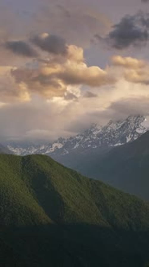Mountain Peaks and Clouds at Scenic Sunset