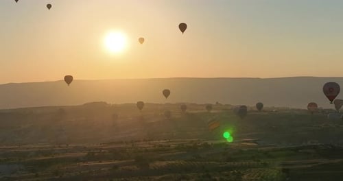 Aerial Cinematic Drone View of Colorful Hot Air Balloon Flying Over Cappadocia
