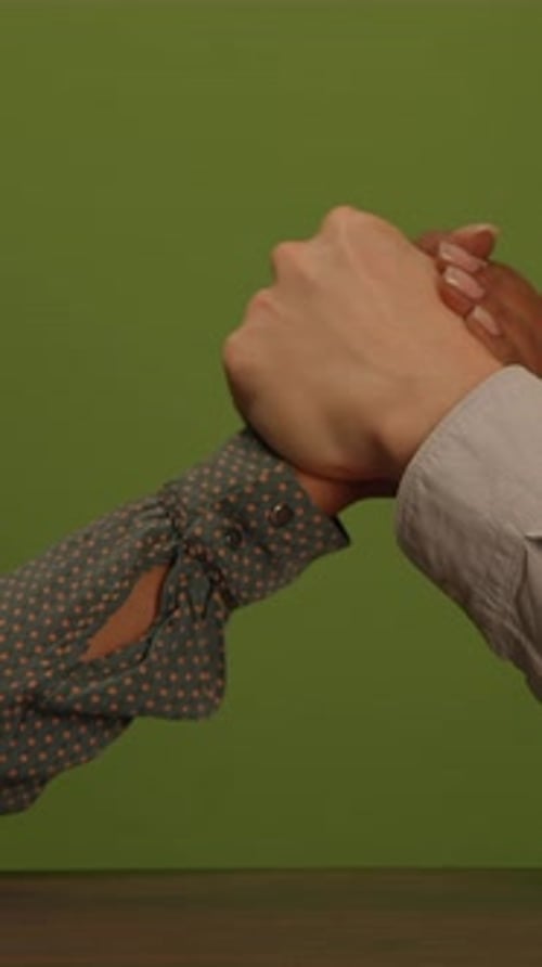 Adult Hands Arm Wrestling on Green Screen