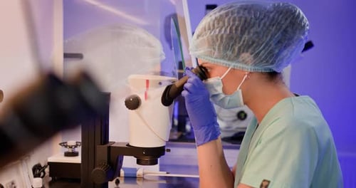 Embryologist Performing Artificial Fertilization in Laboratory