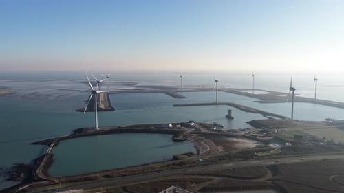 Aerial view of wind turbines near water, Netherlands.