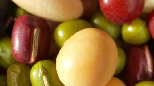 Assorted colorful uncooked beans, close up