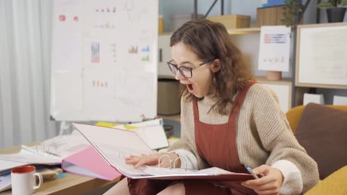 Excited Woman Reacting to Success at Home Office