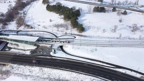 Public transportation train leaving station winter