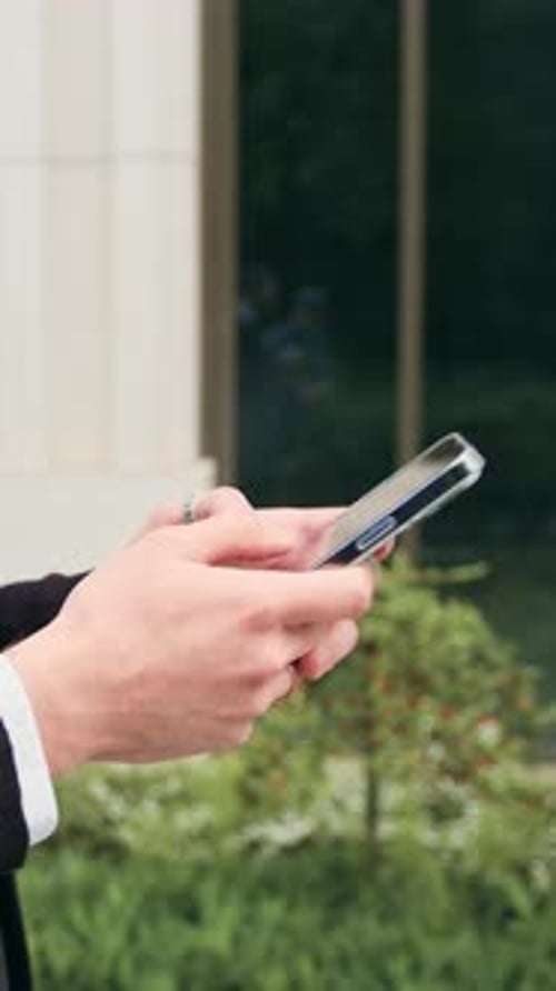 Close Up Text Message Phone and Hands of Black Man in City for Communication Social Media and