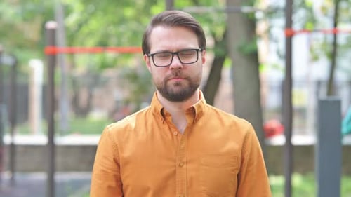 Bearded Man Stares Intently at the Camera